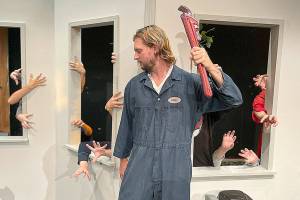 Matthew Nash/Olympic Peninsula News Group 

Justin Stapleton, as Ben, attempts to survive a horde of zombies coming through the windows in Olympic Theatre Arts’ “Night of the Living Dead.” The OTA show opens tonight and runs through Halloween evening.