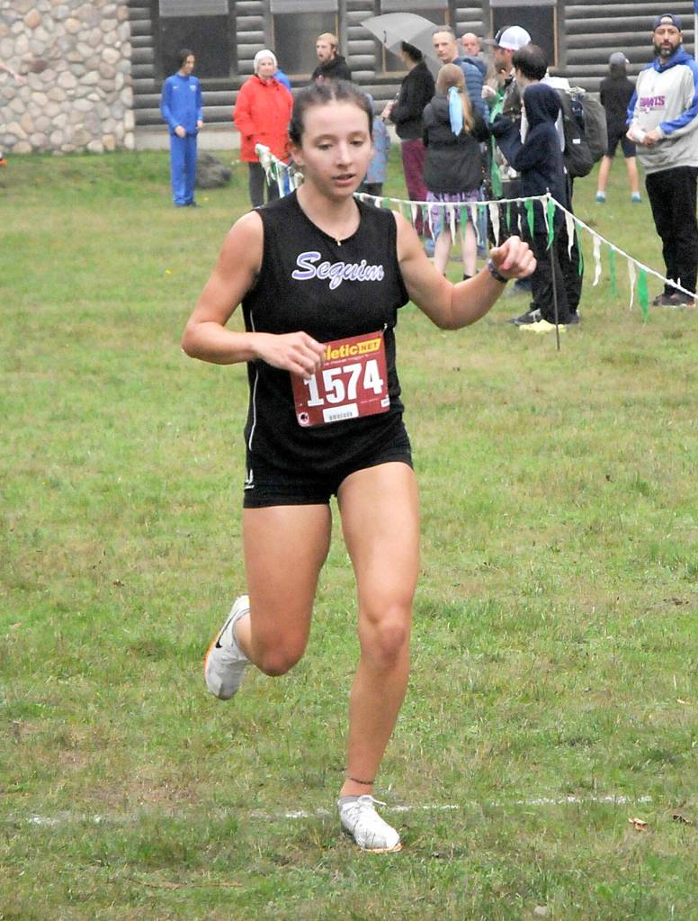 KEITH THORPE/PENINSULA DAILY NEWS Sequims Kaitlyn Bloomenrader crosses the finish line to take second in Thursdays Olympic League Championships at Lincoln Park in Port Angeles.