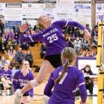 Sequims Jolene Vaara leaps high for a spike against Bremerton on Tuesday as teammates Marissa Gates (36) and Sydney Clark (7) are in on the play. (Michael Dashiell/Olympic Peninsula News Group)