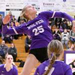 Sequims Jolene Vaara (25) spikes against Bremerton on Tuesday with teammate Arianna Stovall (33) waiting for a possible return. (Michael Dashiell/Olympic Peninsula News Group)