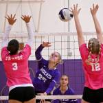 Sequims Jolene Vaara (25) spikes against Bremerton on Tuesday with teammate Arianna Stovall (33) waiting for a possible return. (Michael Dashiell/Olympic Peninsula News Group)