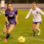 Sequims Olive Bridge, left, grabs possession of the ball and looks for a teammate in the first half of a 6-0 home win Tuesday over Bremerton. (Michael Dashiell/Olympic Peninsula News Group)