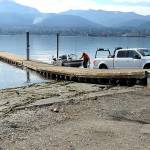 Kyle Kautzman of Sequim loads a boat onto a trailer at the boat launch on Ediz Hook on Thursday. The City of Port Angeles removed a second floating dock at the launch to protect it from adverse weather because repair parts are no longer available. (Keith Thorpe/Peninsula Daily News)