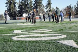 Members of the Port Angeles High School Band perform on the new pitch during Saturdays dedication ceremony for the Port Angeles School Districts Monroe Athletic Field. (Keith Thorpe/Peninsula Daily News)