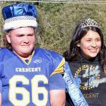 King Wyatt Owens, a lineman for the Crescent High School football team, left, and Queen Ciara Cargo were named homecoming royalty at halftime of the Loggers game against Darrington on Saturday. Both are seniors at the school. (Dave Logan/for Peninsula Daily News)