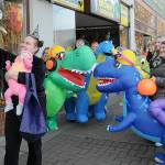Jessica Jackson of Joyce and her son Blakely Baker, 5 months, pose for a selfie with a herd of inflatable dinosaurs ridden by employees of Port Angeles-based Eleven Eleven Dental during Tuesdays Halloween trick-or-treating event in downtown Port Angeles. Riders were, from left, Dr. Erin Ostteen, Taylor Peabody, Krystal Feris, Emma Lindberg, Kelly Wheeleer and Alexis Perry. (Keith Thorpe/Peninsula Daily News)