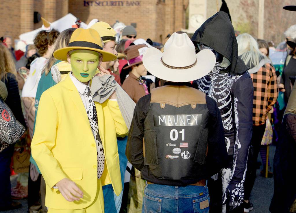 Eliot Mull of Port Townsend wears a costume depicting Jim Carreys character from the movie The Mask during the 27th annual Port Townsend Main Street Program Trick or Treat and Costume Parade on Tuesday. (Steve Mullensky/for Peninsula Daily News)
