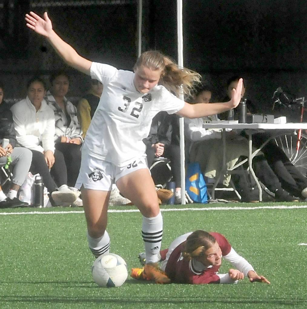 Peninsulas Gemma Rowland, left, avoids trampling North Idahos Mariel Stuart during Saturdays quarterfinal match in Port Angeles. (Keith Thorpe/Peninsula Daily News)