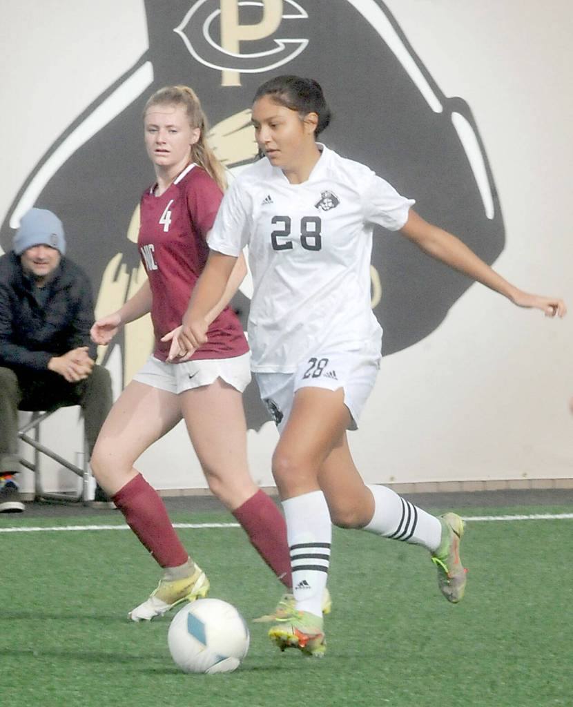 KEITH THORPE/PENINSULA DAILY NEWS
Peninsula's Disidree Dutra, front, slips past the defense of North Idaho's Faith George on Saturday at Wally Sigmar Field.