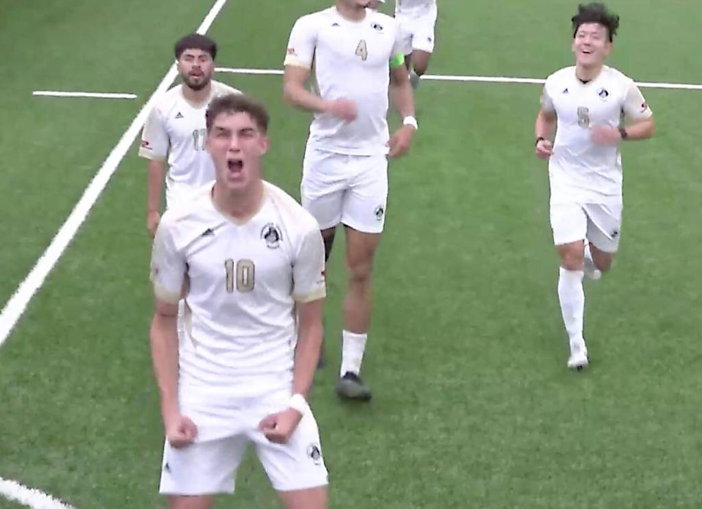 Nils Grau celebrates his second goal in the Pirates NWAC quarterfinals win over Clark. In on the play are Brian Guzman (17), who hit a free kick that Grau headed in, and Rei Sato (5). (NWAC video)