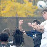 KEITH THORPE/PENINSULA DAILY NEWS
Peninsula's Nil Grau, right, takes the header over Clark's Wilson Fresh as Grau's teammate, Abdurahim Leigh, looks on at front during Saturday's match in Port Angeles.