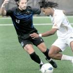 Peninsulas Abdurahim Leigh, front, dribbles past Clarks Isiah Bunda during Saturdays NWAC quarterfinal match at Wally Sigmar Field. (Keith Thorpe/Peninsula Daily News)
