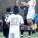 Peninsulas Nil Grau, right, takes the header over Clarks Wilson Fresh as Graus teammate, Abdurahim Leigh, looks on at front during Saturdays match in Port Angeles. (Keith Thorpe/Peninsula Daily News)