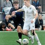 Peninsulas Pip van der Ende, right, races along with Clarks Garik Shevchuk in pursuit on Saturday at Wally Sigmar Field. (Keith Thorpe/Peninsula Daily News)