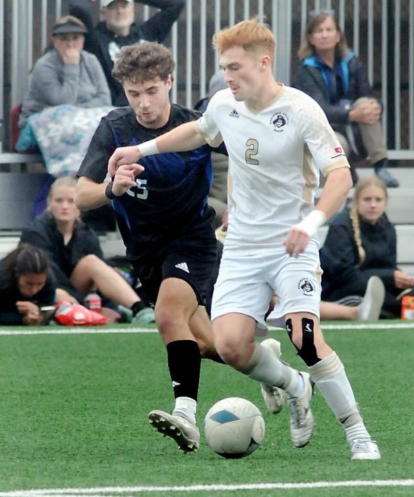 Peninsulas Pip van der Ende, right, races along with Clarks Garik Shevchuk in pursuit on Saturday at Wally Sigmar Field. (Keith Thorpe/Peninsula Daily News)
