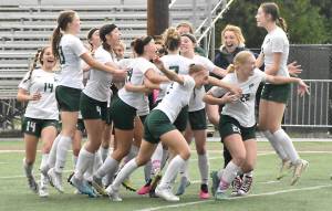 The Port Angeles girls soccer team celebrates beating Enumclaw in penalty kicks and qualifying for the state 2A tournament. (Kevin Hanson)