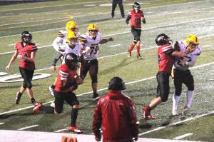 Neah Bays Jodell Wimberley runs against Winlock in a fierce rainstorm in Forks on Friday night. Wimberley scored seven touchdowns as Neah Bay won 86-6. (Lonnie Archibald/for Peninsula Daily News)