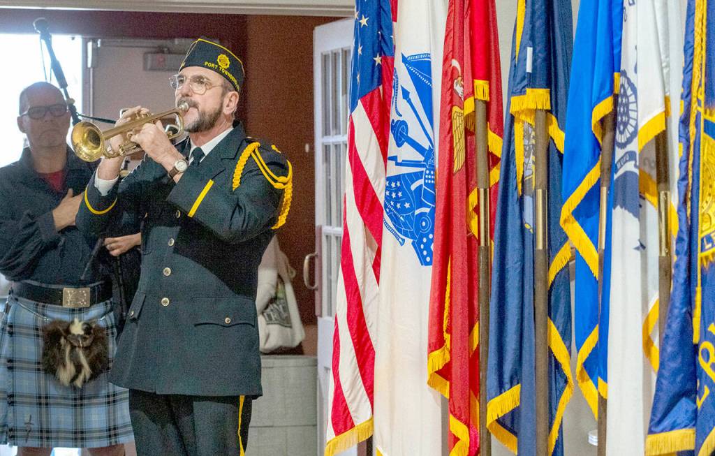 Rick Castellano of Whidbey Island sounds Taps at the conclusion of the 2023 Veterans Day celebration on Saturday at the Marvin G. Shields Memorial Post 26. (Steve Mullensky/for Peninsula Daily News)