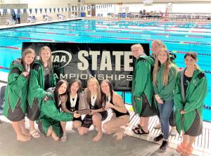 The Port Angeles girls swim team celebrates its fourth-place finish at the state 2A meet held in Federal Way this weekend. From left, Amayah Nelson, Brooke St. Luise, Danika Asgeirsson, Yau Fu, Harper McGuire, Lynzee Reid, Emerson DuBois, Lizzy Shaw, Chloe Kay-Sanders and Oliva Mesen. (Courtesy photo)