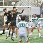 Peninsula Colleges Nil Grau, left, and Abdurahim Leigh battle for a ball in front of the Highline net Sunday in Tukwila. (Jay Cline/Peninsula College)
