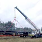 A bridge section is unloaded at a Clallam County gravel pit facility. (Clallam County Public Works)