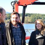 Celebrating the expansion of the Dabob Bay Natural Area by adding 671 acres to the states new carbon sequestration program are, from left, Peter Bahls, Northwest Watershed Institute executive director; Jefferson County Commissioner Greg Brotherton; and state Commissioner of Public Lands Hilary Franz at an oyster farm on Dabob Bay. (Peter Segall/Peninsula Daily News)