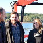 Celebrating the expansion of the Dabob Bay Natural Area by adding 671 acres to the states new carbon sequestration program are, from left, Peter Bahls, Northwest Watershed Institute executive director; Jefferson County Commissioner Greg Brotherton; and state Commissioner of Public Lands Hilary Franz at an oyster farm on Dabob Bay. (Peter Segall/Peninsula Daily News)