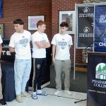 Peninsula College mens soccer coach Jake Hughes, right, holds a gag swear jar poking fun of player Nil Grau, who used a number of swear words during an exuberant live-streamed postgame interview on Sunday after the team defeated Highline in the NWAC championship match on Sunday in Tukwila. The team was honored by the school at the Pirate Union Building on Tuesday. Next to the podium are players, from left, Manny Garcia, Konrad Muller, Pip van der Ende and Alfie Tucker. (Keith Thorpe/Peninsula Daily News)