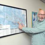Jon Picker, airport and marina manager for the Port of Port Angeles, describes runway sections for William R. Fairchild International Airport on a diagram of the terminal area. (Keith Thorpe/Peninsula Daily News)