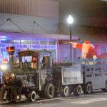 Santa rides down Forks Avenue during the Twinkle Light Parade in 2022 in the West End Business & Professional association train. (Lonnie Archibald/for Peninsula Daily News, file)