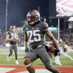 Washington State running back Nakia Watson (25) celebrates his touchdown during the first half of an NCAA college football game against Colorado on Friday in Pullman, Wash. (Young Kwak/The Associated Press)