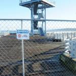 Temporary fencing blocks the end of Port Angeles City Pier at the observation tower after the city closed the area. (Keith Thorpe/Peninsula Daily News)