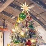 A decorated Christmas tree titled Take Me Back stands at Vern Burton Community Center in Port Angeles on Saturday after fetching the top bid of $7,500 offered by the Jamestown SKlallam Tribe during Saturday nights Festival of Trees gala auction. The tree, designed by Staci Politik and sponsored by Applebees Restaurant, included a $2,000 premium gift certificate for home furnishings from Angeles Furniture. More than 40 trees were auctioned off on Friday as a benefit for the Olympic Medical Center Foundation. (Keith Thorpe/Peninsula Daily News)