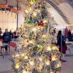 A decorated Christmas tree titled Take Me Back stands at Vern Burton Community Center in Port Angeles on Saturday after fetching the top bid of $7,500 offered by the Jamestown SKlallam Tribe during Saturday nights Festival of Trees gala auction. The tree, designed by Staci Politik and sponsored by Applebees Restaurant, included a $2,000 premium gift certificate for home furnishings from Angeles Furniture. More than 40 trees were auctioned off on Friday as a benefit for the Olympic Medical Center Foundation. (Keith Thorpe/Peninsula Daily News)