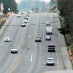 Orange traffic barrels line the sides of U.S. Highway 101 at Ennis Creek for preliminary surveys in preparation for upcoming culvert replacement. (Keith Thorpe/Peninsula Daily News)