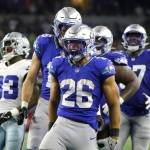 Seattle Seahawks running back Zach Charbonnet (26) celebrates after running the ball for a long gain in the second half of an NFL football game against the Dallas Cowboys in Arlington, Texas on Thursday. (Michael Ainsworth/The Associated Press)