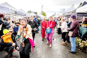 Kristin Smith fiddles the opening of this seasons Port Townsend Farmers Market on April 1. The market closes on Saturday. (Sarah Wright Photography)