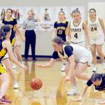 Forks Fynlie Peters (right) competes with North Beach for ball control Tuesday evening in the Spartan Gym where Forks defeated the Hyaks 81-12. Also in the action for Forks, from left, are Bailey Johnson, Karee Neal and Kareena Nandial. (Lonnie Archibald/for Peninsula Daily News)