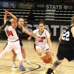 Neah Bays Amber Swan drives around a screen set by teammate Cerise Moss (14) during a Class 1B state tournament quarterfinal against Oakesdale at the Spokane Arena last March. (Byrne Bennett/Cheney Free Press)