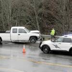 A truck rests against a guardrail on U.S. Highway 101 west of North Brook Avenue at Lees Creek east of Port Angeles on Thursday. (Keith Thorpe/Peninsula Daily News)