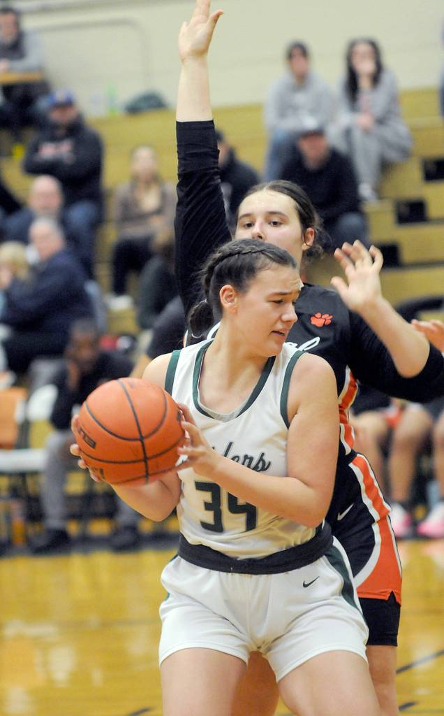 Port Angeles Lexie Smith, front, looks for away around Central Kitsaps Sam Schaeffer on Saturday in Port Angeles. (Keith Thorpe/Peninsula Daily News)