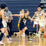 Forks Aidan Salazar drives up court against the Ilwaco defense on Wednesday night in the Spartan Gym where the Fishermen came from behind in the second half to defeat the Spartant 64-41. (Lonnie Archibald/for Peninsula Daily News)
