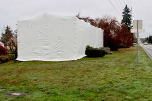 DAVE LOGAN/FOR PENINSULA DAILY NEWS Engine #4 is covered in a tarp in preparation for asbestos removal, which will be followed by restoration.