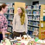 Port Townsend Library Director Melody Sky Weaver, left, and Library Manager of Youth & Outreach Services Emily Bufford marvel at the dozens of entries in the librarys Uptown Gingerbread Contest. Voting ended Monday and winners of the all-edible competition will be announced Friday. At the Jefferson County Library, 31 gingerbread houses  18 from youth  were entered into the Home for the Holidays: Gingerbread House Making Contest. The deadline to vote in that contest is 5 p.m. today. Winners in both contests will be announced on Friday. Houses are on display at the Port Townsend Library at 1220 Lawrence St. and the Jefferson County Library at 620 Cedar Ave., Port Hadlock. (Diane Urbani de la Paz/For Peninsula Daily News)
