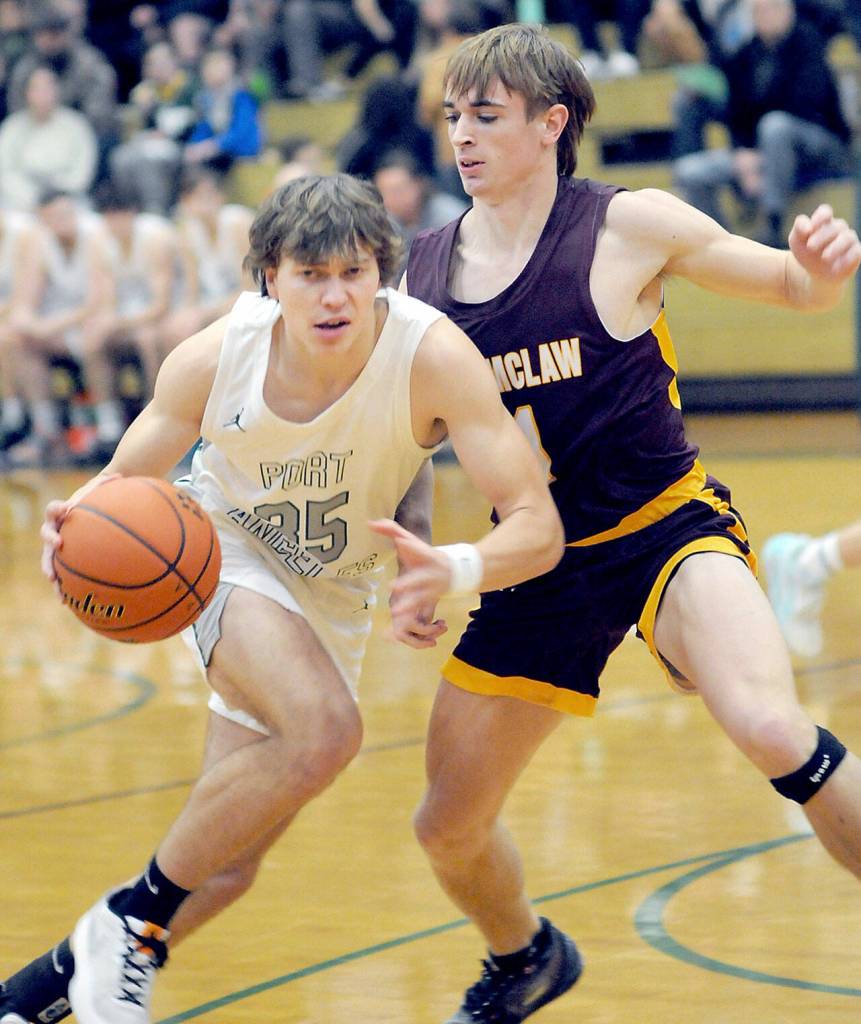 Port Angeles Parker Nickerson, left, eases past the defense of Enumclaws Wyatt Neu on Wednesday afternoon in Port Angeles. (Keith Thorpe/Peninsula Daily News)