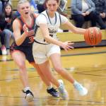 KEITH THORPE/PENINSULA DAILY NEWS Port Angeles Teanna Clark, right, slips around the defense of Washougals Addilyn Gibbons during Thursdays game in Port Angeles.