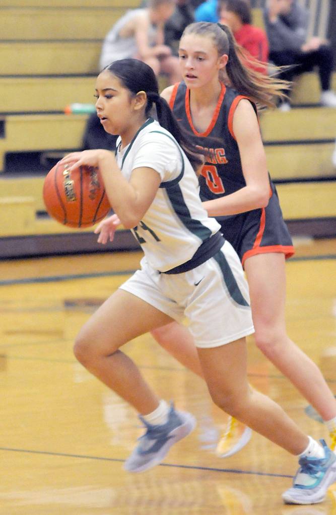 KEITH THORPE/PENINSULA DAILY NEWS
Port Angeles' Kenzie Moses, front, drives past Washougal's Avery Dixson on Thursday in Port Angeles.