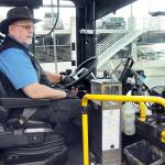 Clallam Transit driver Duane Benedict looks down at his fare box before departing The Gateway transit center in downtown Port Angeles on Saturday  the last day of collecting fares on most bus routes. (Keith Thorpe/Peninsula Daily News)