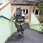 Clallam County Fire District 2 firefighter/EMT Anaka Hughes makes her way up the stairs behind the Conrad Dyar Memorial Fountain in Port Angeles on Saturday to gather donations and pledges supporting the upcoming Leukemia & Lymphoma Society Firefighter Stairclimb on March 10 at the Columbia Center in Seattle. The North Olympic Firefighters Team consisting of firefighters from Fire District 2 and the Port Angeles Fire Department will join about 2,000 firefighters from across the region in the event, ascending 69 floors with 1,356 steps of Seattles tallest skyscraper benefiting blood cancer research and patient services. The North Olympic team plans another fundraising event with stairclimb machines on March 10 at Bourbon West, 125 W. Front St. in Port Angeles. (Keith Thorpe/Peninsula Daily News)