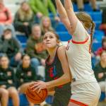 East Jeffersons Kateyn Riley keeps her eyes on the basket while being closely guarded against Washougal on Saturday in Chimacum. (Steve Mullensky/for Peninsula Daily News)